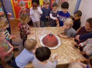 We made a volcano out of paper mache, then filled it with vinegar and bicarbonate of soda. Look what happened....